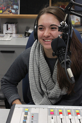 Senior Cougar Radio Music Director Alison Counterman during a radio show. 