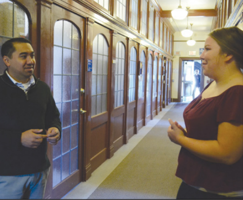 Fomr right to left: Student Kassie Cebula and Assistant Director of Enrollment Management
Cheyne Wago meet in the hall of admissions department.