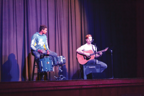 Mike Ryan and his friend singing and playing guitar for his talent portion.