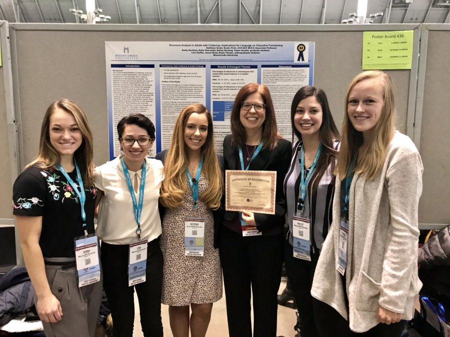From left to right, Jenna Reed, Lisa Giuffre, Katrina Giacumbo, Dr. Kathleen Scaler Scott, Bailey Hartung, and Taylor Header pose in front of their recognized poster.