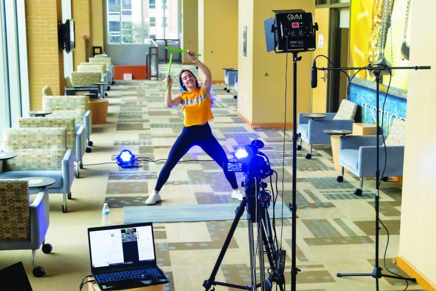 Alison Counterman ’16 leads a virtual POUND workout.