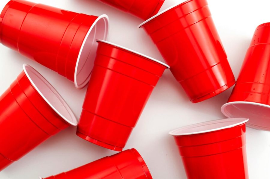 College+party+and+beer+pong+concept+with+red+drinking+plastic+cups+on+white+background