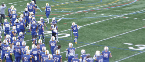 #21 T.J. Prather celebrates his fumble recovery with the “Turnover Cane”.