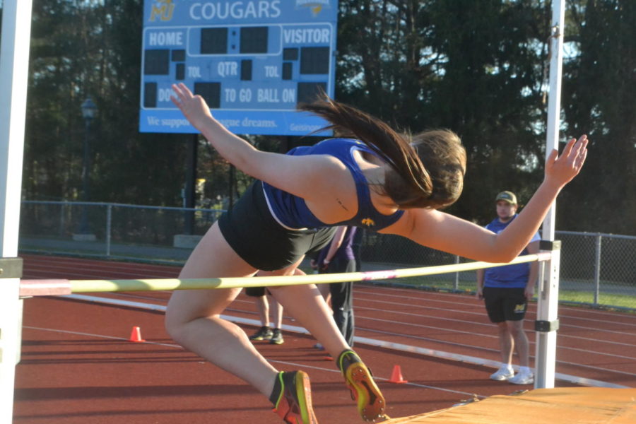 Freshman Casey Allen shows off her
form, jumping over 5’6 at the meet. Allen won first place.