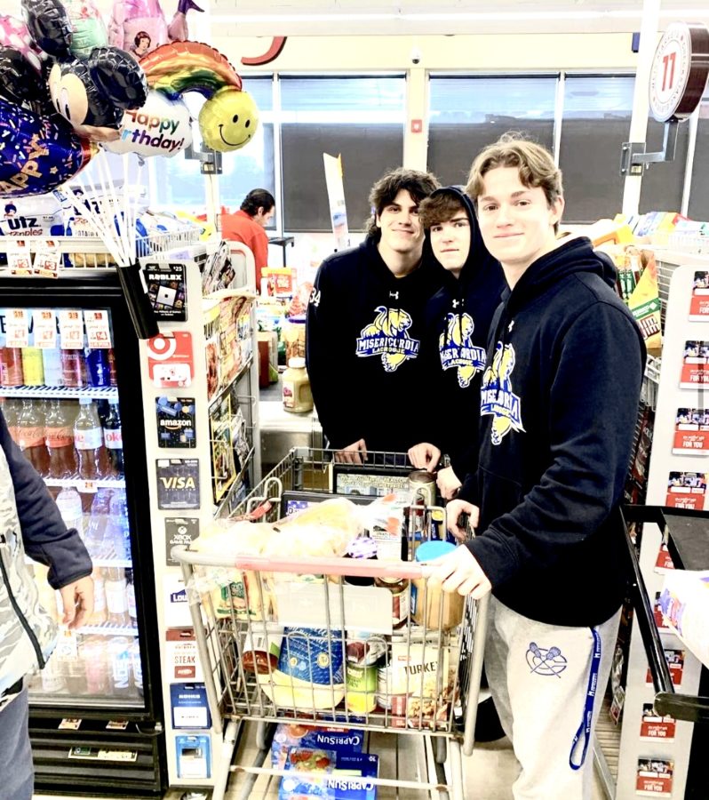 (Left to right) Sophomore Men’s Lacrosse players
Sean Wallace, Jared Pelliccione, and Matt Coates purchasing food for a family in need last November