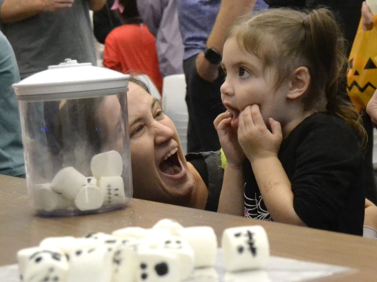 Families enjoying vacuum science demonstration at the Henry Science Center Wednesday October 23, 2024